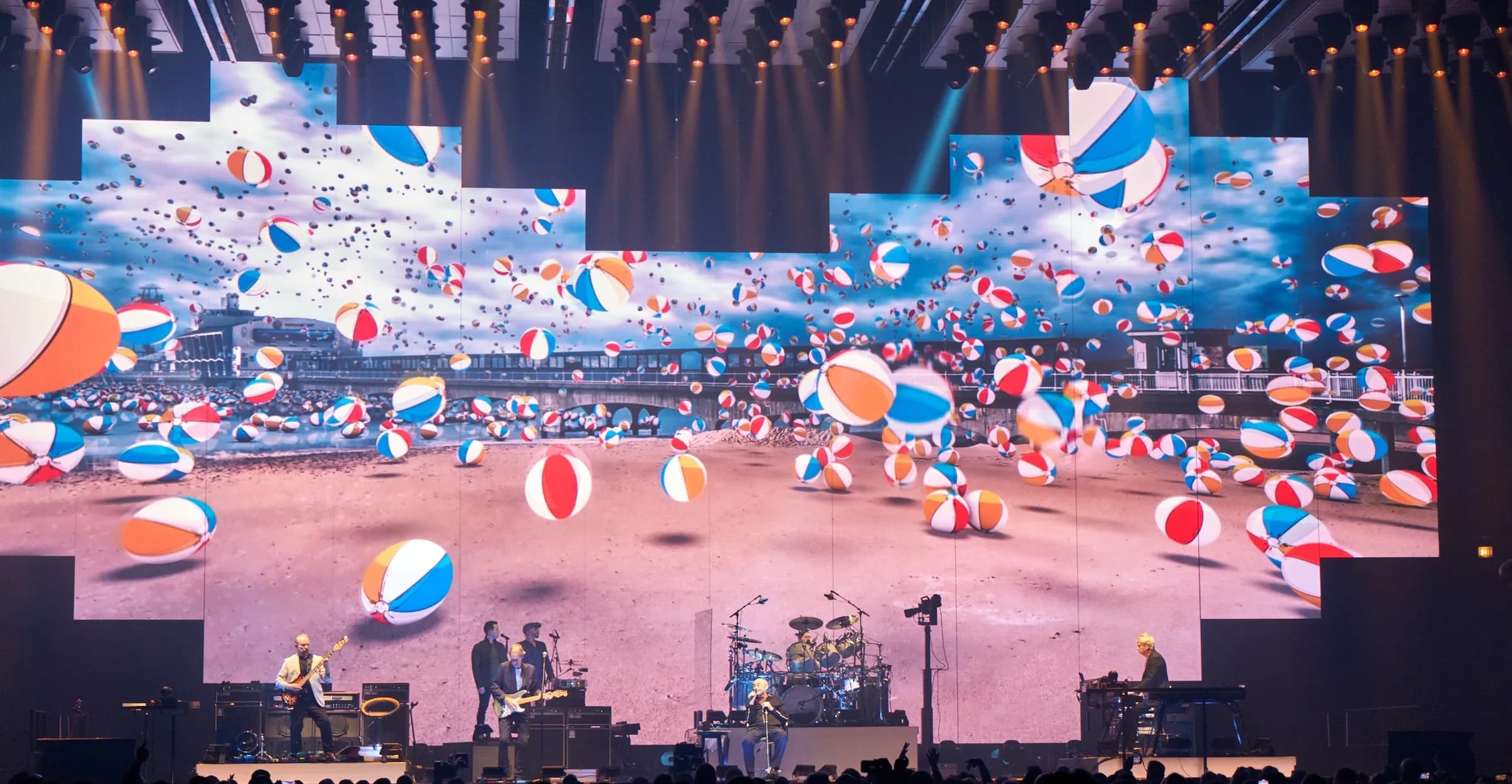 Genesis stage production with beach ball visuals at the United Center, Chicago